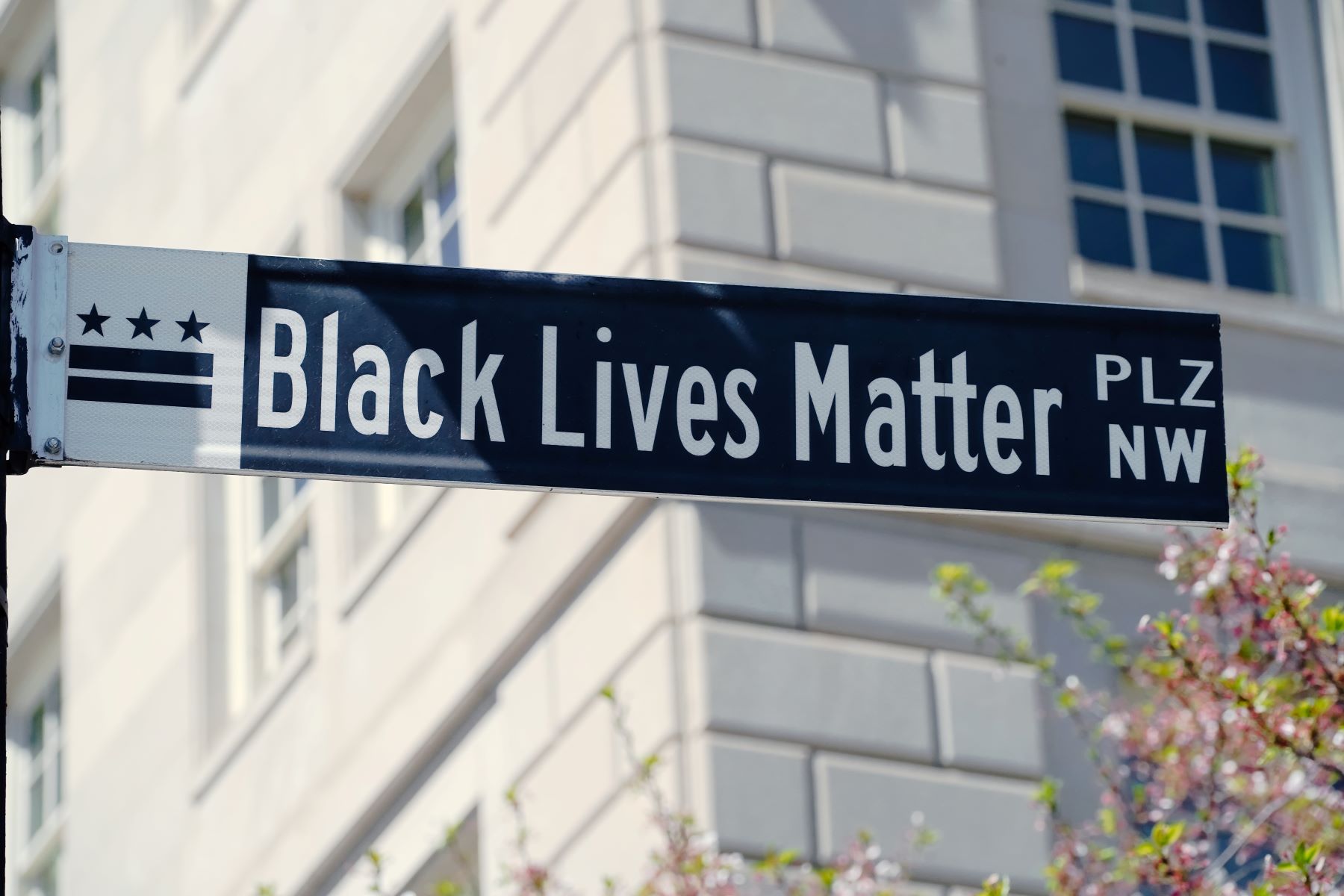 People of color marching with #blacklivesmatter signs