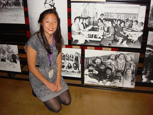 Yuri's family member posed in front of an exhibit to Yuri