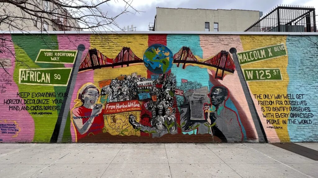 Malcolm X mural on the outside of a building
